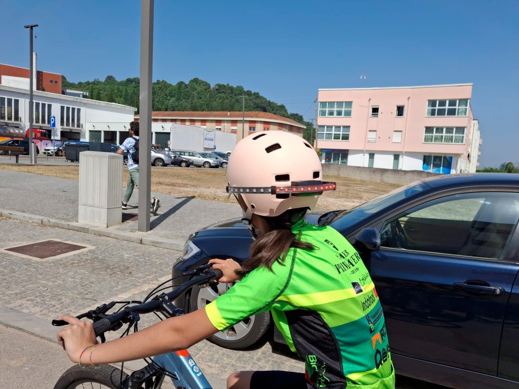 Kid riding a bike using Firefly Helmet Light